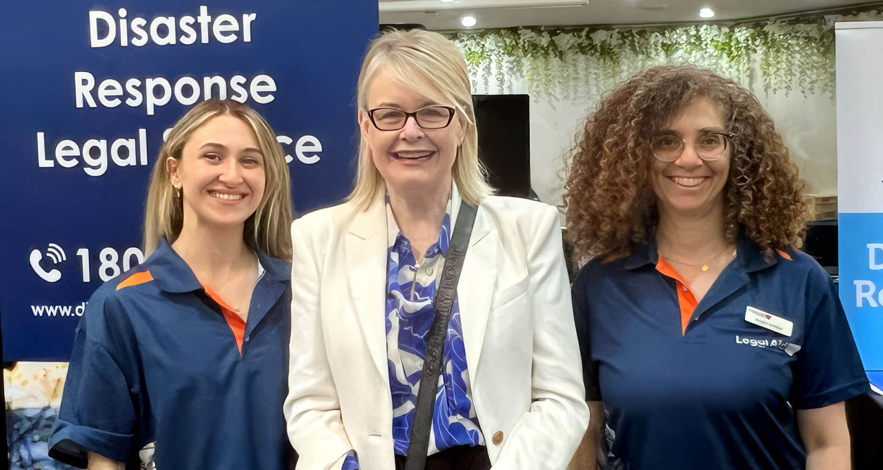 NSW Reconstruction Authority Head of Preparedness and Recovery, Joanna Quilty standing alongside DRLS representatives at the Windsor Recovery Assistance Point